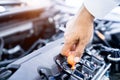 Hand checking engine oil, change oil car engine Royalty Free Stock Photo