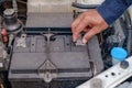 Hand checking and repairing car battery Royalty Free Stock Photo