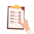 Hand with checklist. Hand holding and completing checklist on clipboard. Business concept. Royalty Free Stock Photo