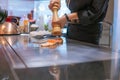 Hand of Chef cooking salmon steak Royalty Free Stock Photo