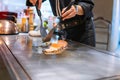 Hand of Chef cooking salmon steak Royalty Free Stock Photo