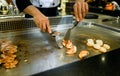 Hand of Chef cooking salmon steak Royalty Free Stock Photo