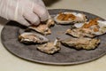 Chef Preparing Cajun Oysters on the Half Shell Royalty Free Stock Photo