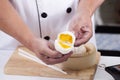 Hand of chefd holding steamed dumpling bun