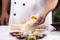 Hand of chefd holding steamed dumpling bun Royalty Free Stock Photo