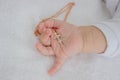 hand of a child with a cross, baptism of a child Royalty Free Stock Photo