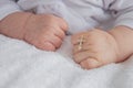 hand of a child with a cross, baptism of a child Royalty Free Stock Photo