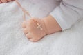 hand of a child with a cross, baptism of a child Royalty Free Stock Photo