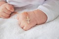 hand of a child with a cross, baptism of a child Royalty Free Stock Photo