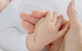 hand of a child with a cross, baptism of a child Royalty Free Stock Photo