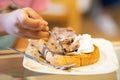 Hand of a child eating chocolate ice cream toast bread, selective focus Royalty Free Stock Photo