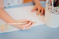 Hand of child girl drawing with pencils at home Royalty Free Stock Photo