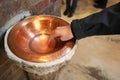 hand of the child and the holy water stew with blessed water