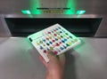 Hand of a child returning a book into an automated book return machine