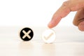 Hand choose check mark on wooden toy with cross symbol for true or false changing mindset or way of adapting to change leader and Royalty Free Stock Photo