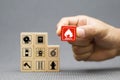Hand choose cube wooden block stack with fire icon and door exit sing or fire escape with prevent icon
