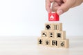 Hand choose cube wooden block stack with fire icon and door exit sing or fire escape with prevent icon