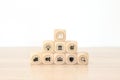 Hand choose cube wooden block stack pyramid with graph and business strategy icon for target goal to growth and financial