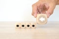 Hand chooses arrow icon point to the opposite side on cube wooden block stack pyramid concept of adaptation challenge change Royalty Free Stock Photo