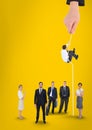 Hand choosing a man with a rope on a yellow background with business people Royalty Free Stock Photo