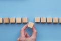 Hand choosing a wooden block from a set. Business choice concept Royalty Free Stock Photo