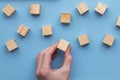 Hand choosing a wooden block from a set. Business choice concept Royalty Free Stock Photo