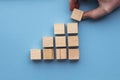 Hand choosing a wooden block from a set. Business choice concept Royalty Free Stock Photo