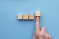 Hand choosing a wooden block from a set. Business choice concept Royalty Free Stock Photo