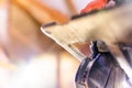 Hand circular saw close-up, bottom view. Wheel teeth on wood Royalty Free Stock Photo