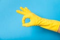 Hand in clean yellow glove, bathroom Royalty Free Stock Photo