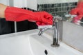 Hand cleaning bathroom sink with brush Royalty Free Stock Photo
