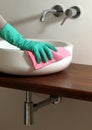 Cleaning bathroom sink Royalty Free Stock Photo