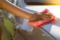 Hand  cleaning car with microfiber cloth, car detailing or valeting concept Royalty Free Stock Photo