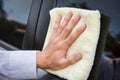 Hand cleaning the car window with microfiber cloth Royalty Free Stock Photo