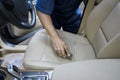 Hand cleaning the leather car seat Royalty Free Stock Photo