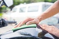 Hand with cleaning motorcycle