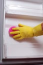 Hand cleaning refrigerator. Royalty Free Stock Photo