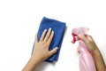 Hand cleaning with spray bottle and blue rag Royalty Free Stock Photo