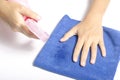 Hand cleaning with spray bottle and blue rag Royalty Free Stock Photo