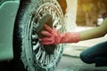 Hand cleaning tire car wash with sponge Royalty Free Stock Photo