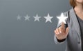 Hand of Client pressing Five Star Excellent survey Rating