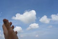 Hand and cloudy sky Royalty Free Stock Photo