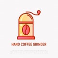 Hand coffee grinder with coffee bean thin line icon. Modern vector illustration for cafe logo