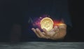 Hand of a coin a casual businessman wondering what the future. Digital cash system and associated currency coin digital