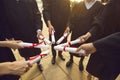 Hand of college graduates holding diploma degree certificate joining together. Graduate.