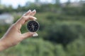 Hand compass in nature background