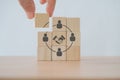 hand complete circle shape screen on wooden cube block for teamwork, brainstorming, cooperation for business growin