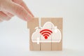 Hand complete cloud icon shape on wood block isolated background for for technology, networking concept