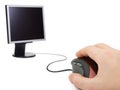 Hand with computer mouse and monitor Royalty Free Stock Photo