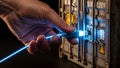Hand connecting a glowing ethernet cable to a server rack for data transfer access Royalty Free Stock Photo